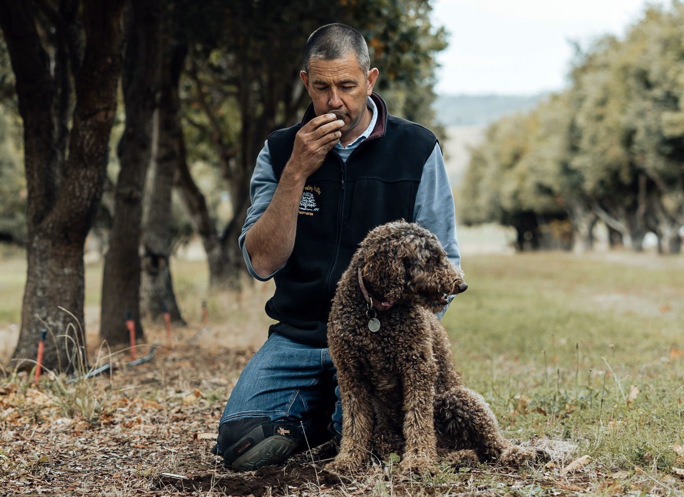 Marcus and dog testing the aroma of a truffle